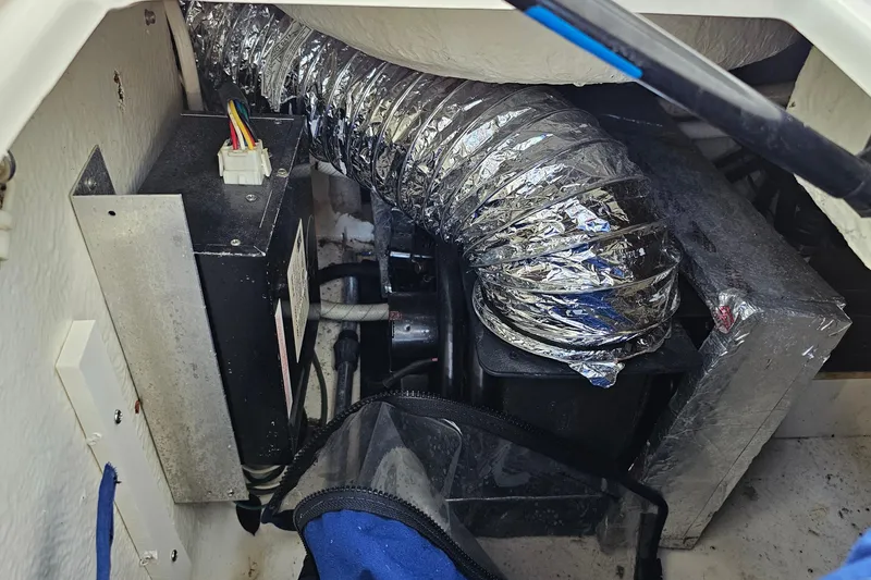 Slide: The Image of Engine compartment of 2002 Chaparral 285 SSi with ductwork and electrical components. - 22