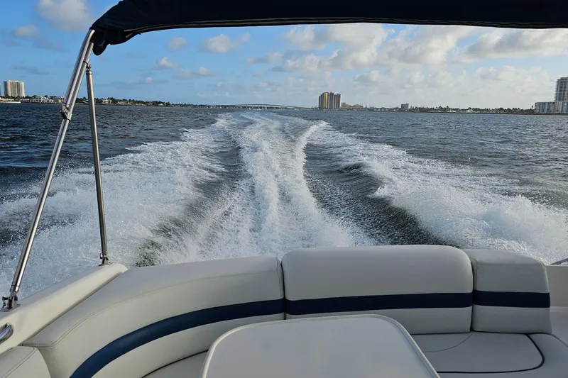 Slide: The Image of Chaparral 285 SSi boat cruising on open water, leaving a wake behind, 2002 model. - 30