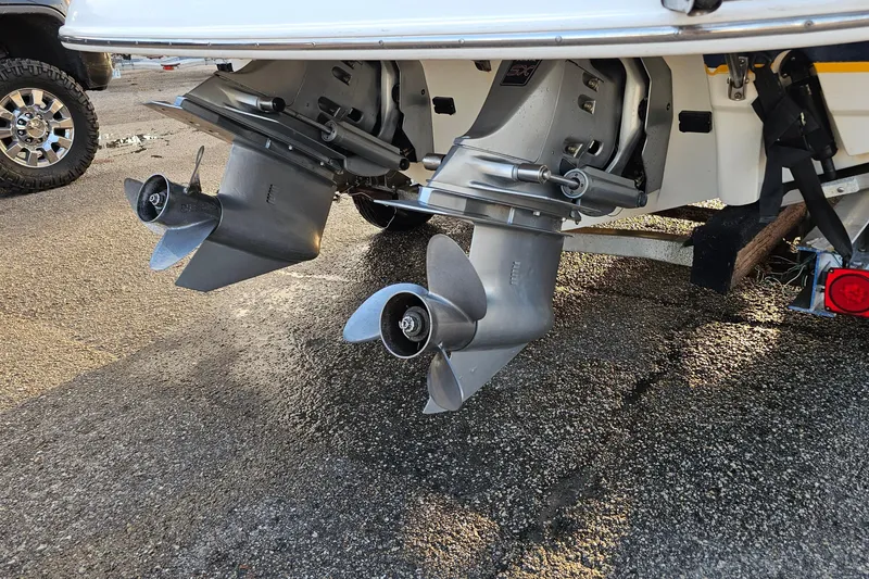 Slide: The Image of Rear view of 2002 Chaparral 285 SSi boat with dual propellers on a trailer. - 34