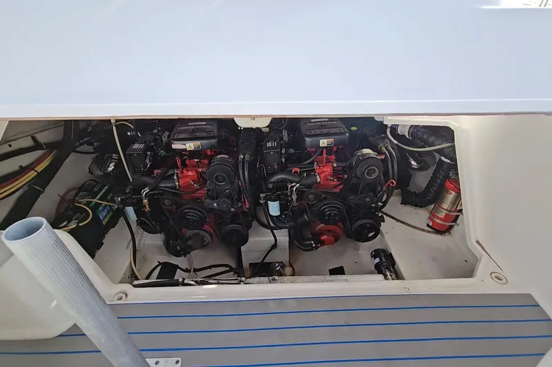 Slide: The Image of Engine compartment of a 2002 Chaparral 285 SSi boat, featuring dual engines. - 37