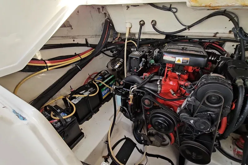 Slide: The Image of Engine compartment of 2002 Chaparral 285 SSi boat with visible batteries and wiring. - 38