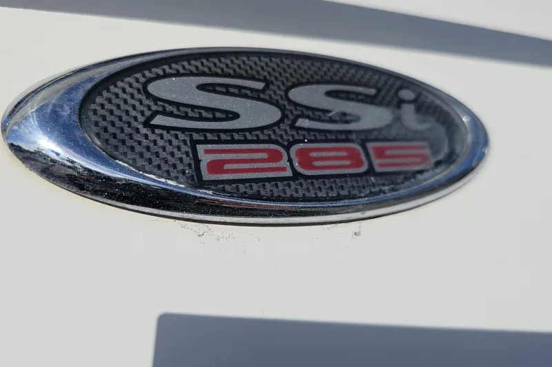 Slide: The Image of 2002 Chaparral 285 SSi emblem on a white surface, close-up view. - 6