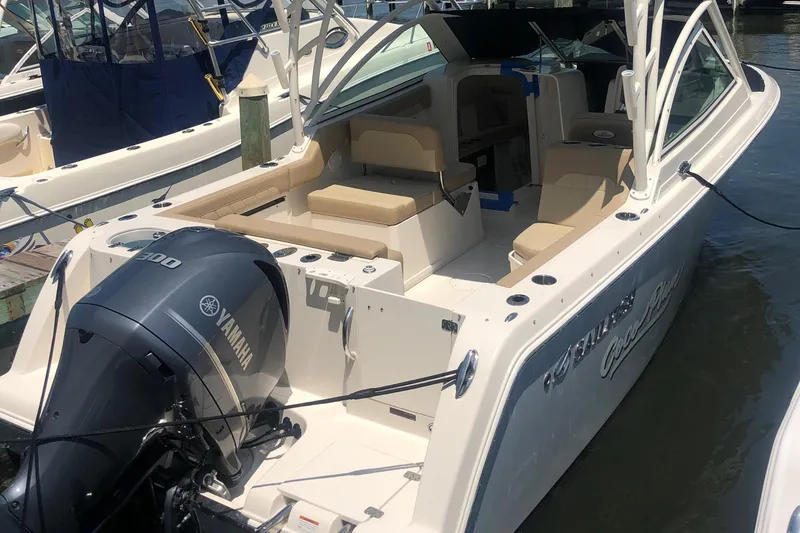The Image of 2020 Sailfish 245 DC boat with Yamaha engine docked at marina. - 0