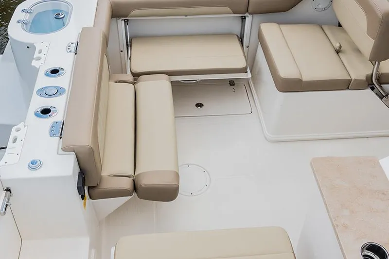 Slide: The Image of 2020 Sailfish 245 DC boat with Yamaha 300 engine under protective cover. - 12