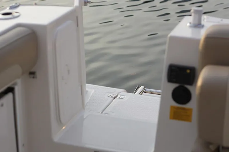 Slide: The Image of 2020 Sailfish 245 DC boat helm with Garmin navigation system and steering wheel. - 14