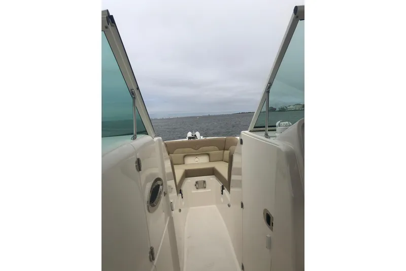 Slide: The Image of Steering console of 2020 Sailfish 245 DC boat with navigation controls and specifications. - 16