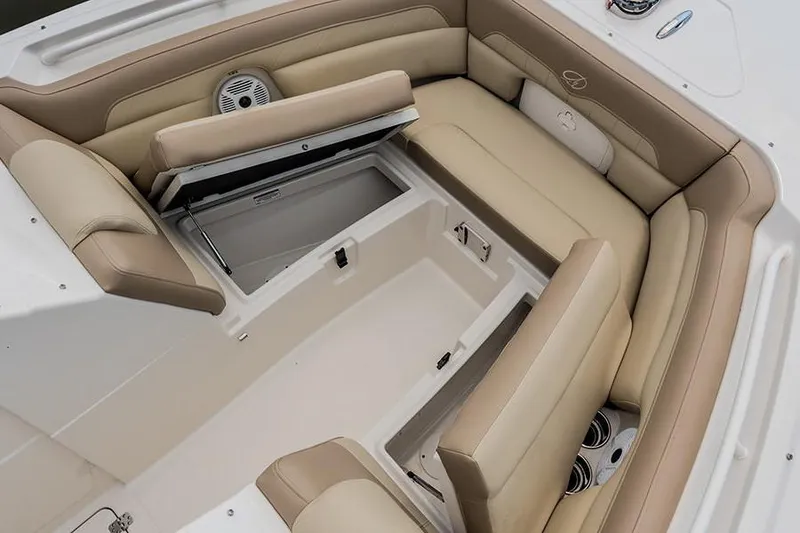 Slide: The Image of Interior of a 2020 Sailfish 245 DC boat with beige seating and storage compartments. - 5