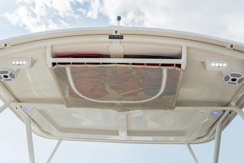 Slide: The Image of 2020 Sailfish 245 DC boat covered, for sale in snowy outdoor setting. - 9