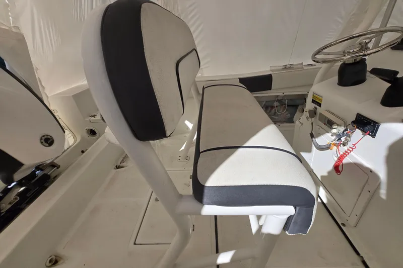Slide: The Image of 2018 Clearwater 2000 Center Console boat interior with steering wheel and seating. - 5