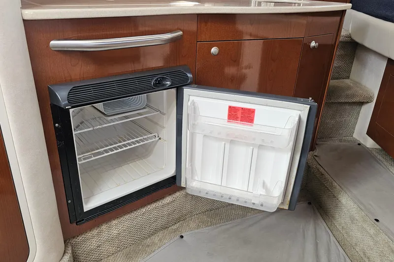 Slide: The Image of Open mini fridge in 2008 Sea Ray Sundancer 310 yacht interior. - 17