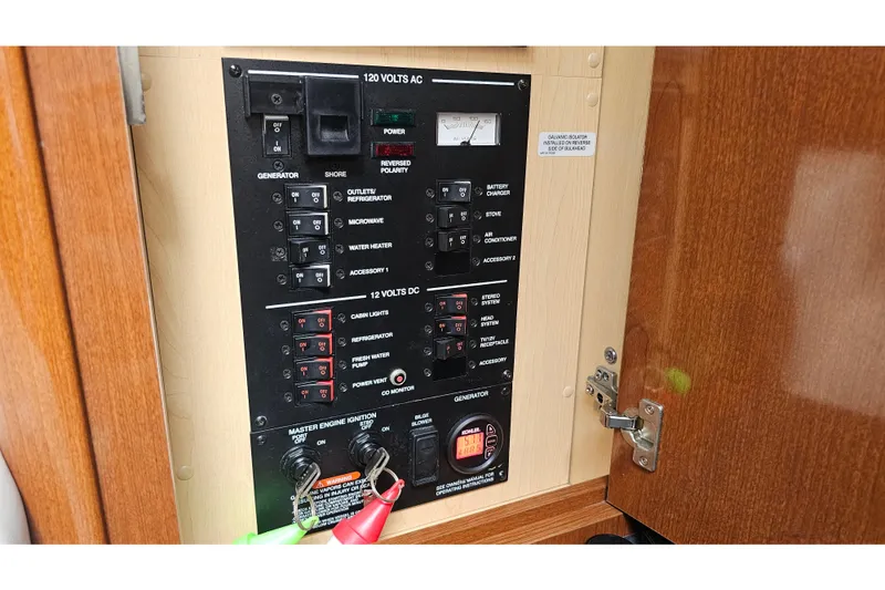 Slide: The Image of Electrical control panel on a 2008 Sea Ray Sundancer 310 boat. - 21