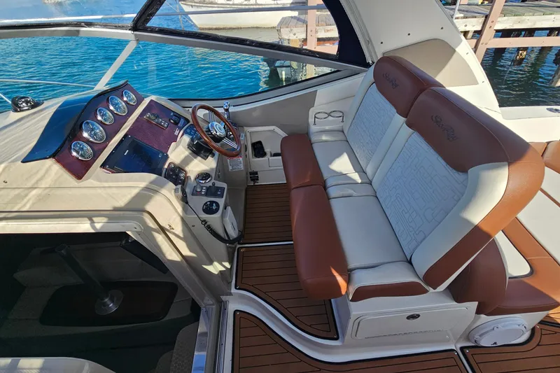 Slide: The Image of 2008 Sea Ray Sundancer 310 cockpit with leather seating and modern dashboard controls. - 35