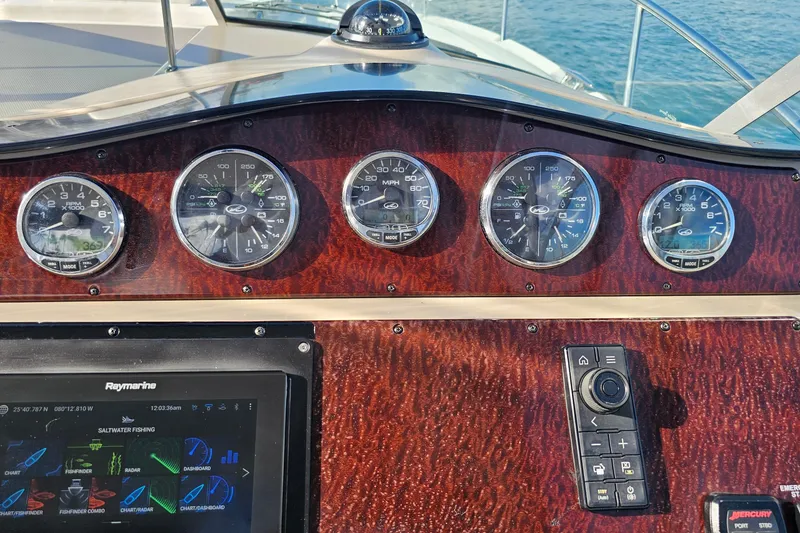 Slide: The Image of Dashboard of 2008 Sea Ray Sundancer 310 with gauges and navigation system. - 47