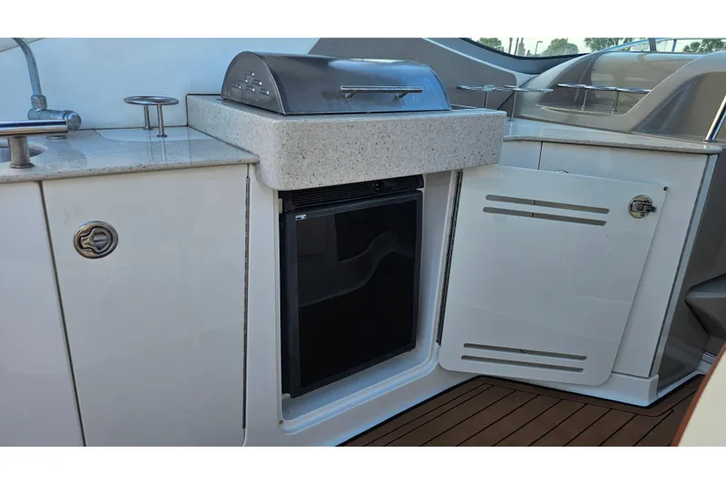 Slide: The Image of 2008 Sea Ray Sundancer 310 yacht kitchenette with grill and mini fridge. - 57