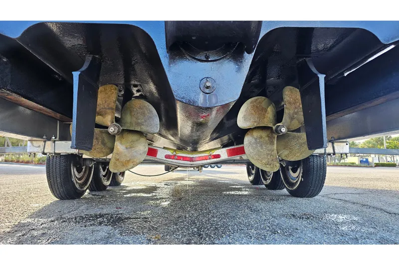 Slide: The Image of Underneath view of 2008 Sea Ray Sundancer 310 boat with dual propellers on a trailer. - 63