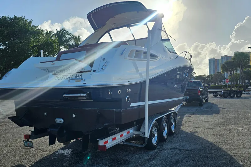 Slide: The Image of 2008 Sea Ray Sundancer 310 boat on trailer, parked in sunny lot, Boston, MA. - 65