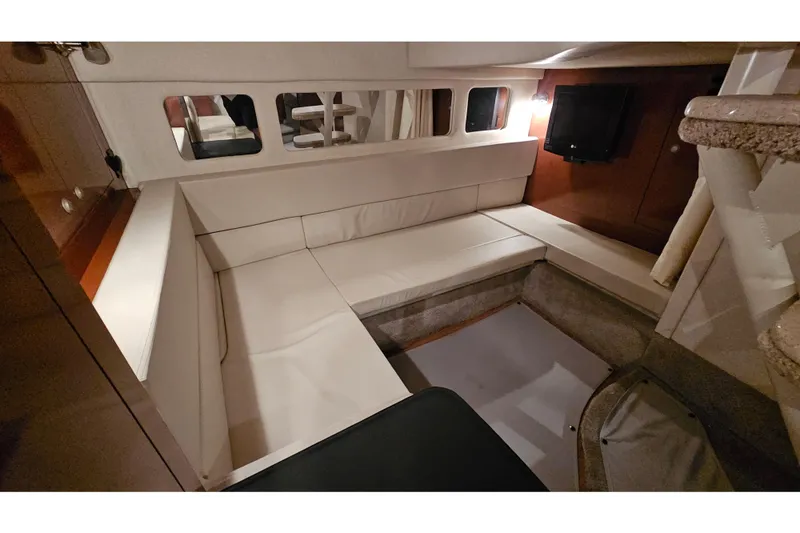 Slide: The Image of Interior of 2008 Sea Ray Sundancer 310, featuring cozy seating and modern amenities. - 71
