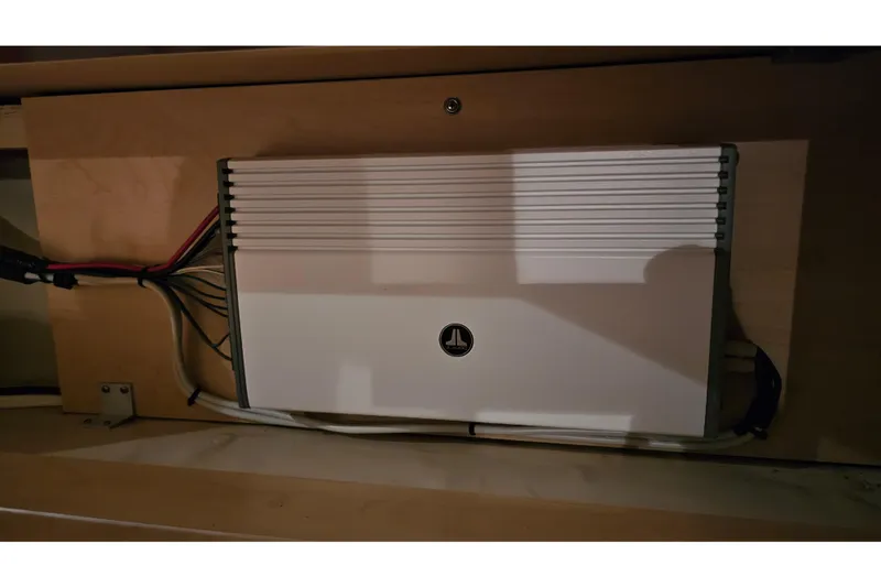 Slide: The Image of Electrical component inside a 2008 Sea Ray Sundancer 310 boat, mounted on a wooden panel. - 72