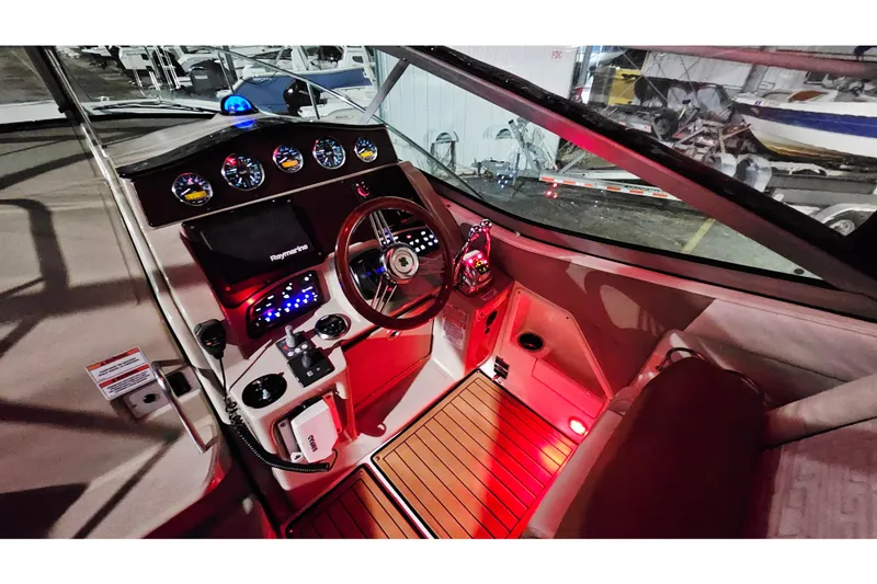 Slide: The Image of 2008 Sea Ray Sundancer 310 helm with illuminated controls and modern navigation system. - 78