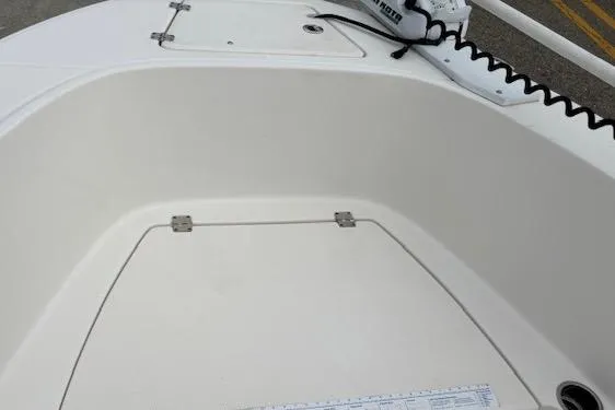 Slide: The Image of 2018 Robalo R180 Center Console boat deck with storage compartment. - 10