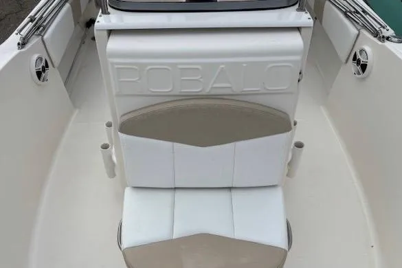 Slide: The Image of 2018 Robalo R180 Center Console boat interior with seating and cup holders. - 11