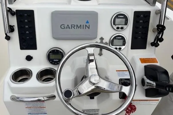 Slide: The Image of 2018 Robalo R180 Center Console dashboard with Garmin navigation and control instruments. - 7