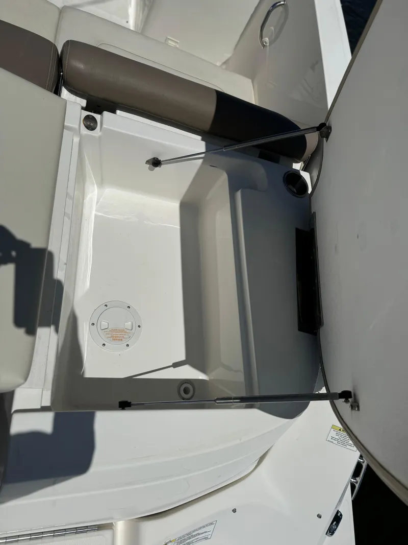 Slide: The Image of 2013 Sea Ray 300 SLX storage compartment with open hatch. - 13