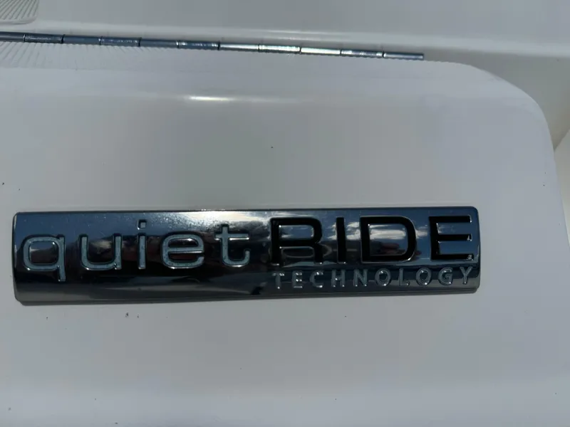 Slide: The Image of Quiet Ride Technology badge on 2013 Sea Ray 300 SLX boat. - 14