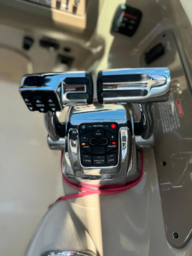 Slide: The Image of Close-up of 2013 Sea Ray 300 SLX boat throttle controls. - 5