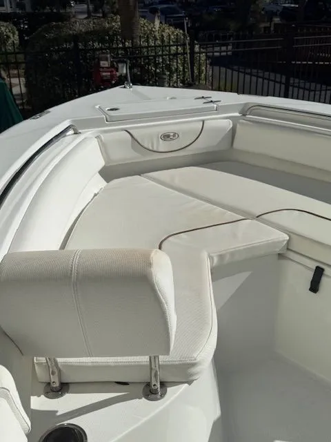 Slide: The Image of Interior view of a 2019 Sea Hunt Ultra 211 boat with white seating. - 5