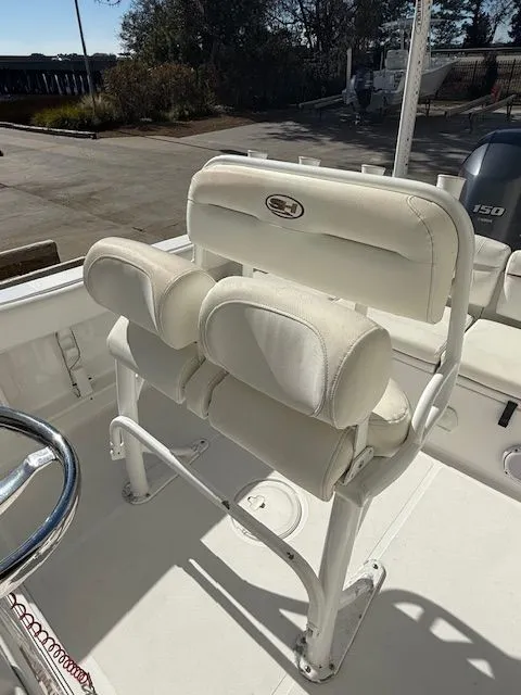 Slide: The Image of 2019 Sea Hunt Ultra 211 boat seat with white upholstery. - 9