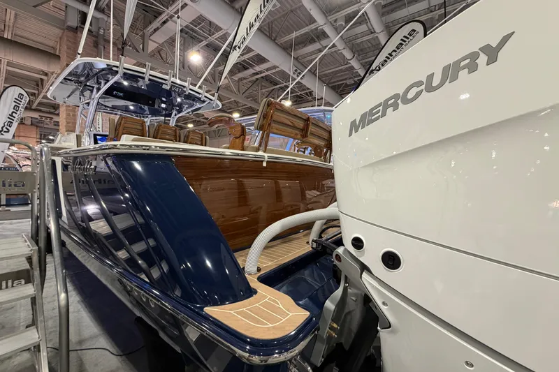 Slide: The Image of 2026 Valhalla Boatworks V-41 with Mercury engine at a boat show display. - 11