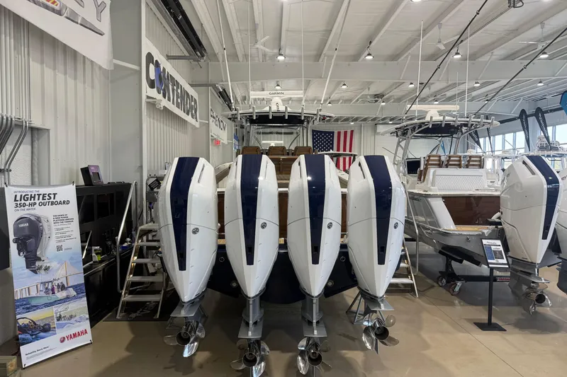Slide: The Image of 2026 Valhalla Boatworks V-41 with Yamaha outboards displayed in a showroom. - 12