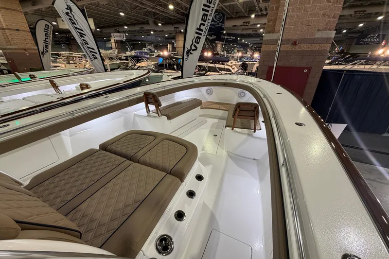 Slide: The Image of 2026 Valhalla Boatworks V-41 interior at a boat show, featuring luxurious seating and modern design. - 5