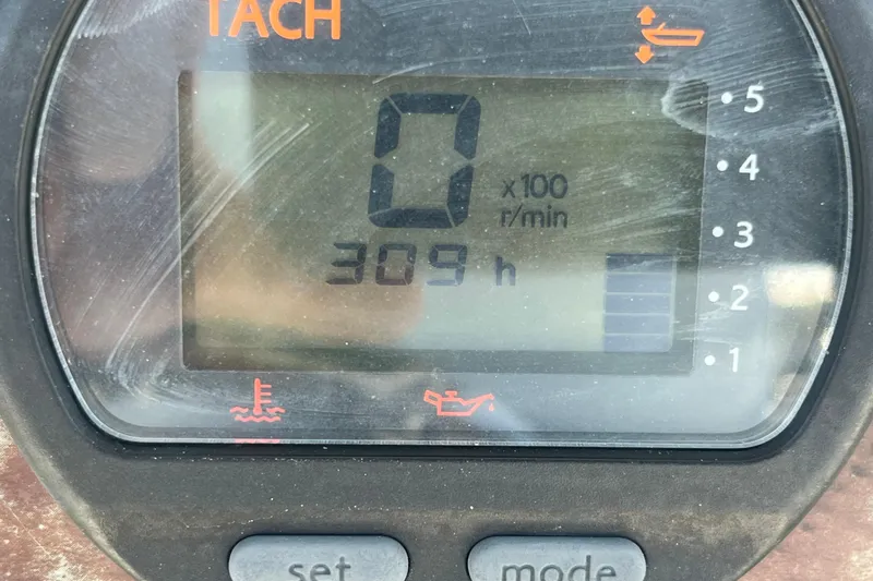 Slide: The Image of Tachometer display showing 309 hours on a 2014 Sea Hunt Ultra 211 boat. - 21