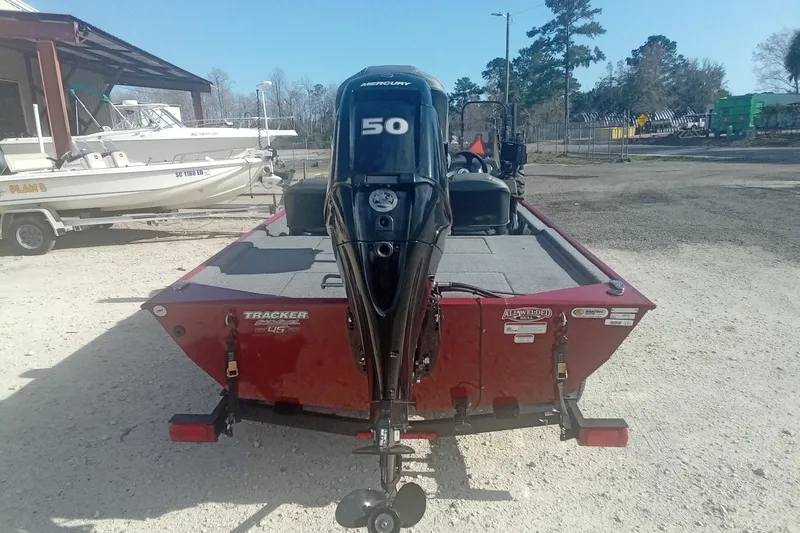 Slide: The Image of 2023 Tracker Bass Tracker Classic XL boat with Mercury 50 engine, parked outdoors. - 11