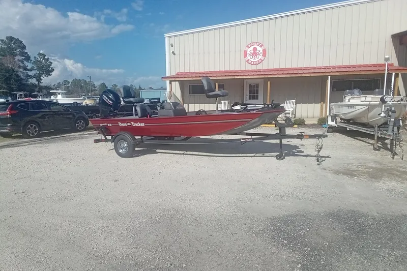 Slide: The Image of 2023 Tracker Bass Tracker Classic XL boat on trailer outside a building. - 3
