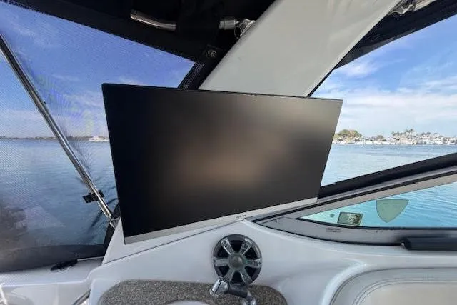 Slide: The Image of Flat-screen TV on 2009 Chaparral Signature 290 boat, with scenic water view. - 10