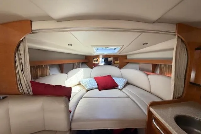 Slide: The Image of Interior of 2009 Chaparral Signature 290 boat with cozy seating and cushions. - 6