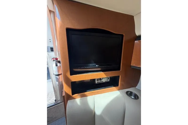 Slide: The Image of 2009 Chaparral Signature 290 interior with built-in LG TV and audio system. - 7