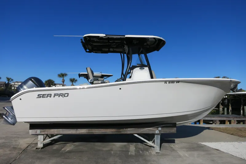 The Image of 2021 Sea Pro 239 Deep V CC boat on display under clear blue sky. - 0