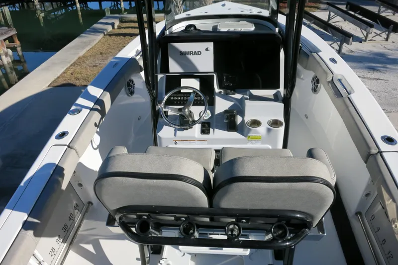 Slide: The Image of 2021 Sea Pro 239 Deep V CC boat interior with steering console and seating. - 13