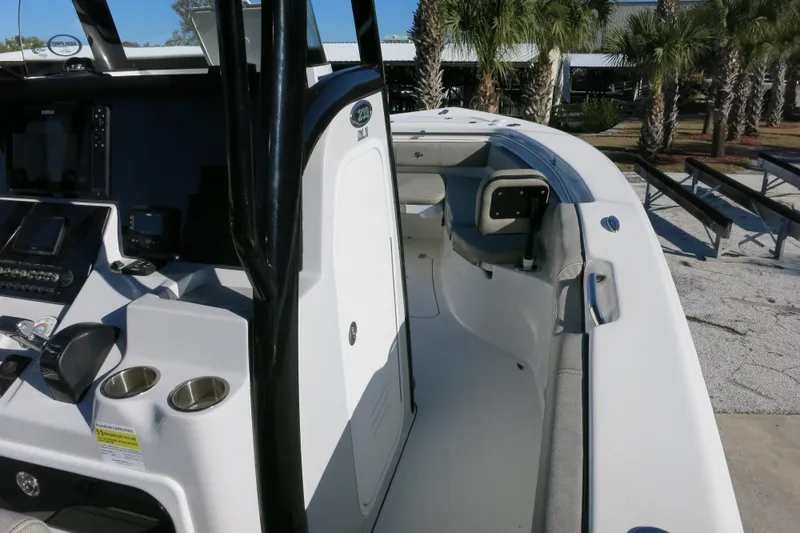 Slide: The Image of 2021 Sea Pro 239 Deep V CC boat interior with console and seating area. - 18