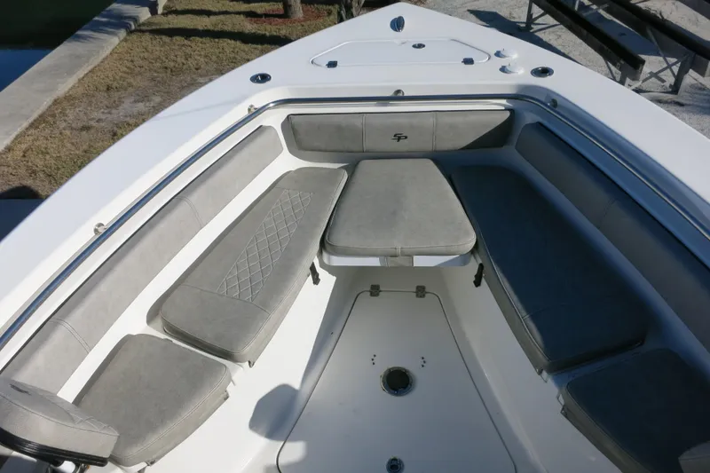Slide: The Image of 2021 Sea Pro 239 Deep V CC boat interior with cushioned seating and storage. - 20