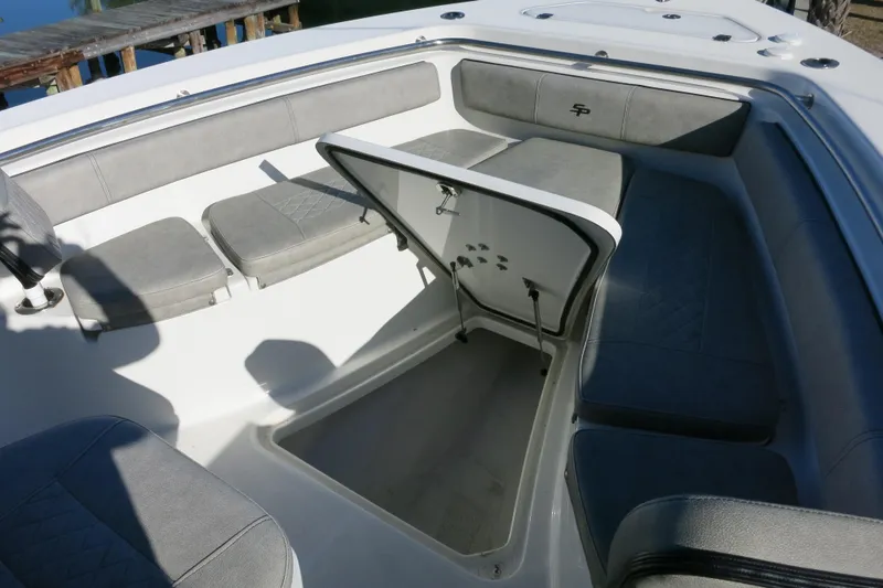 Slide: The Image of 2021 Sea Pro 239 Deep V CC boat interior with open storage compartment. - 21