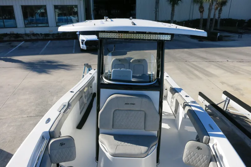 Slide: The Image of 2021 Sea Pro 239 Deep V CC boat with center console and seating, docked outdoors. - 26