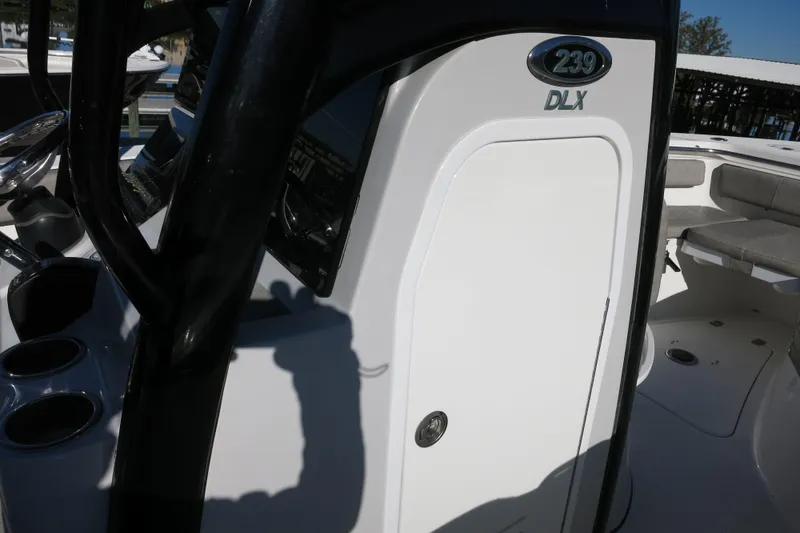 Slide: The Image of 2021 Sea Pro 239 Deep V CC boat interior with console and seating area. - 27