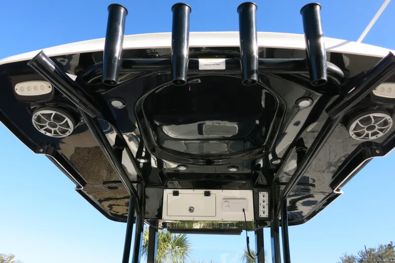 Slide: The Image of 2021 Sea Pro 239 Deep V CC boat with black T-top and rod holders. - 28