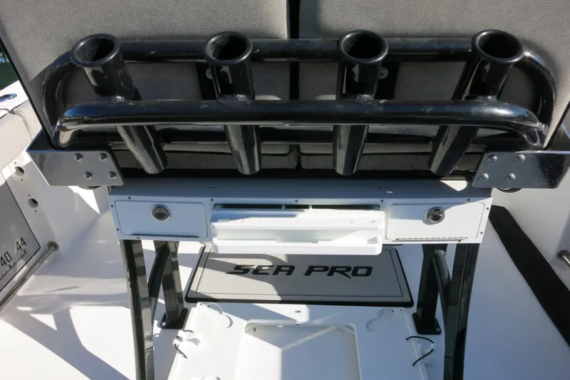 Slide: The Image of 2021 Sea Pro 239 Deep V CC boat with rod holders and storage compartments. - 29