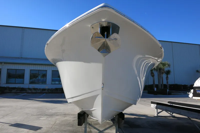 Slide: The Image of 2021 Sea Pro 239 Deep V CC boat on trailer, front view, outdoors. - 3